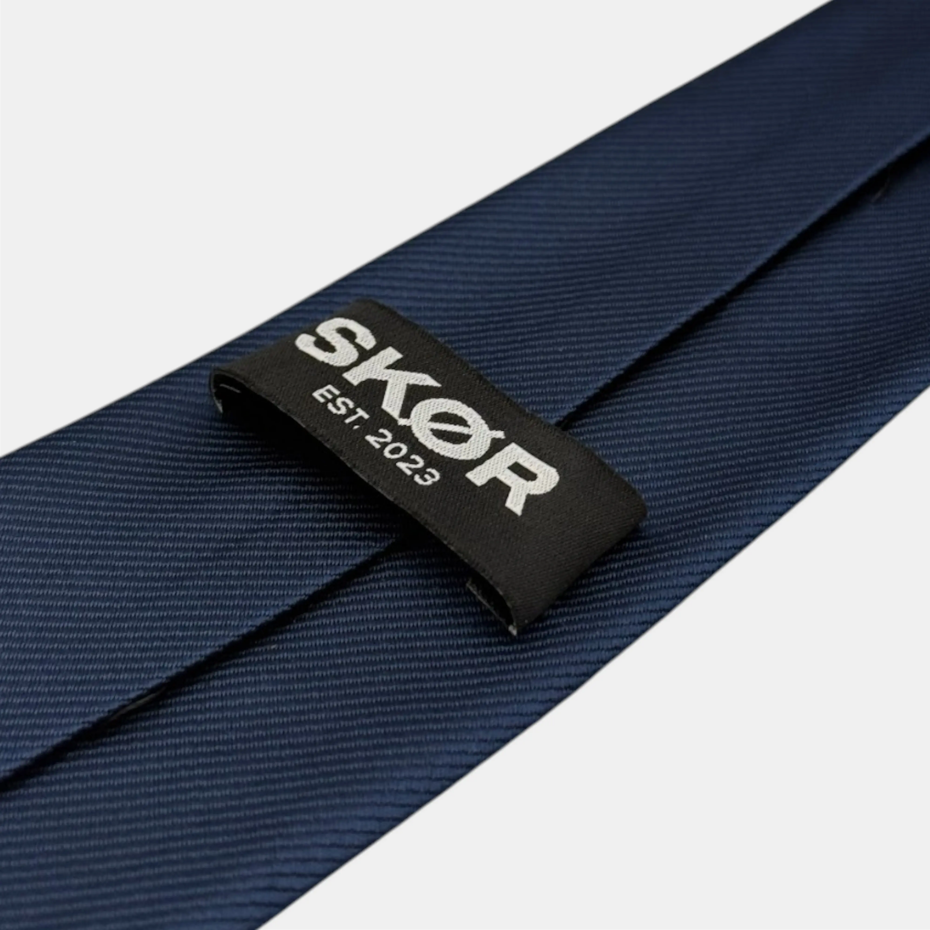 NAVY TIE SKØR